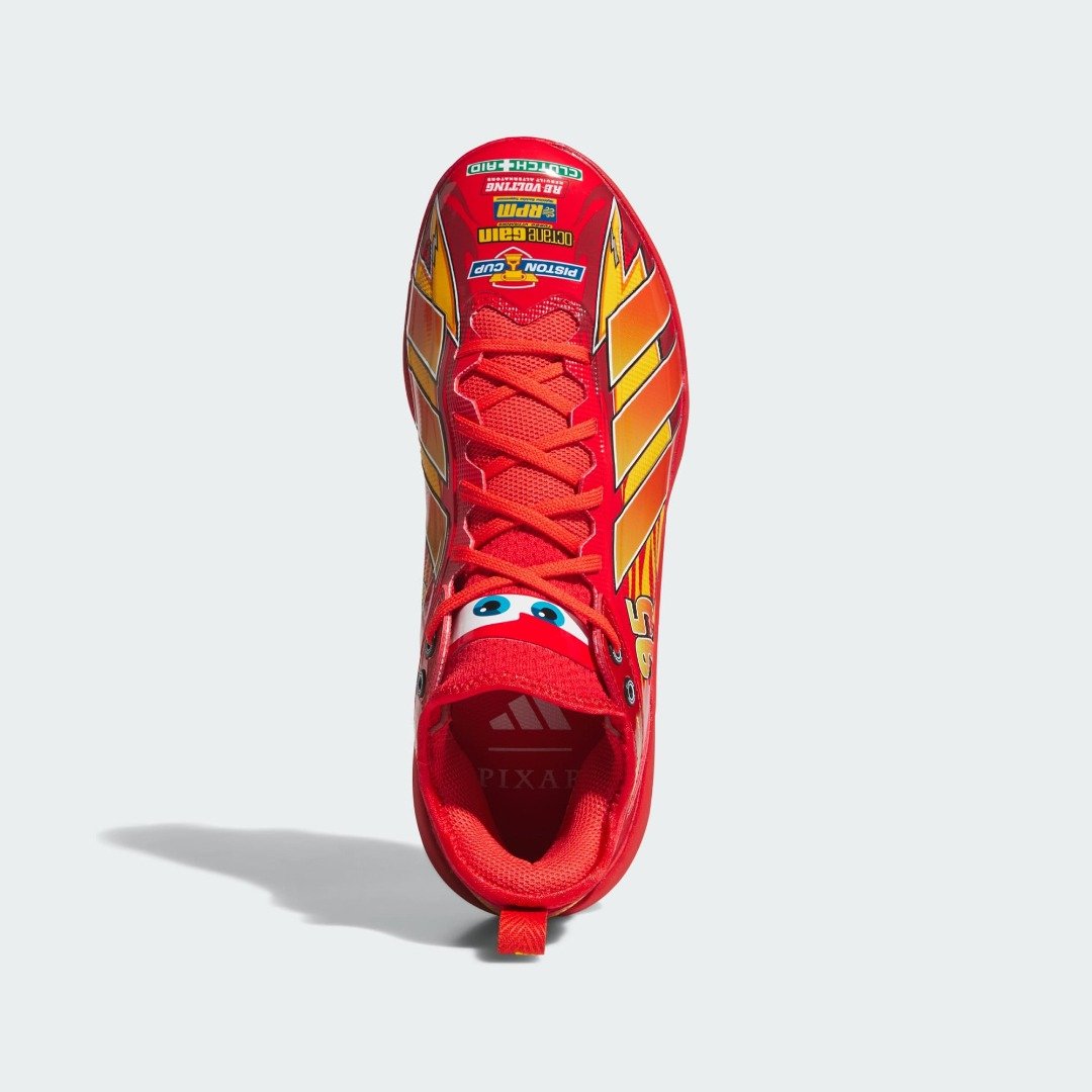Top-down view of the adidas Pixar Cars Adizero Impact 3.0 TPU cleat with Piston Cup style sponsor decals on the tongue