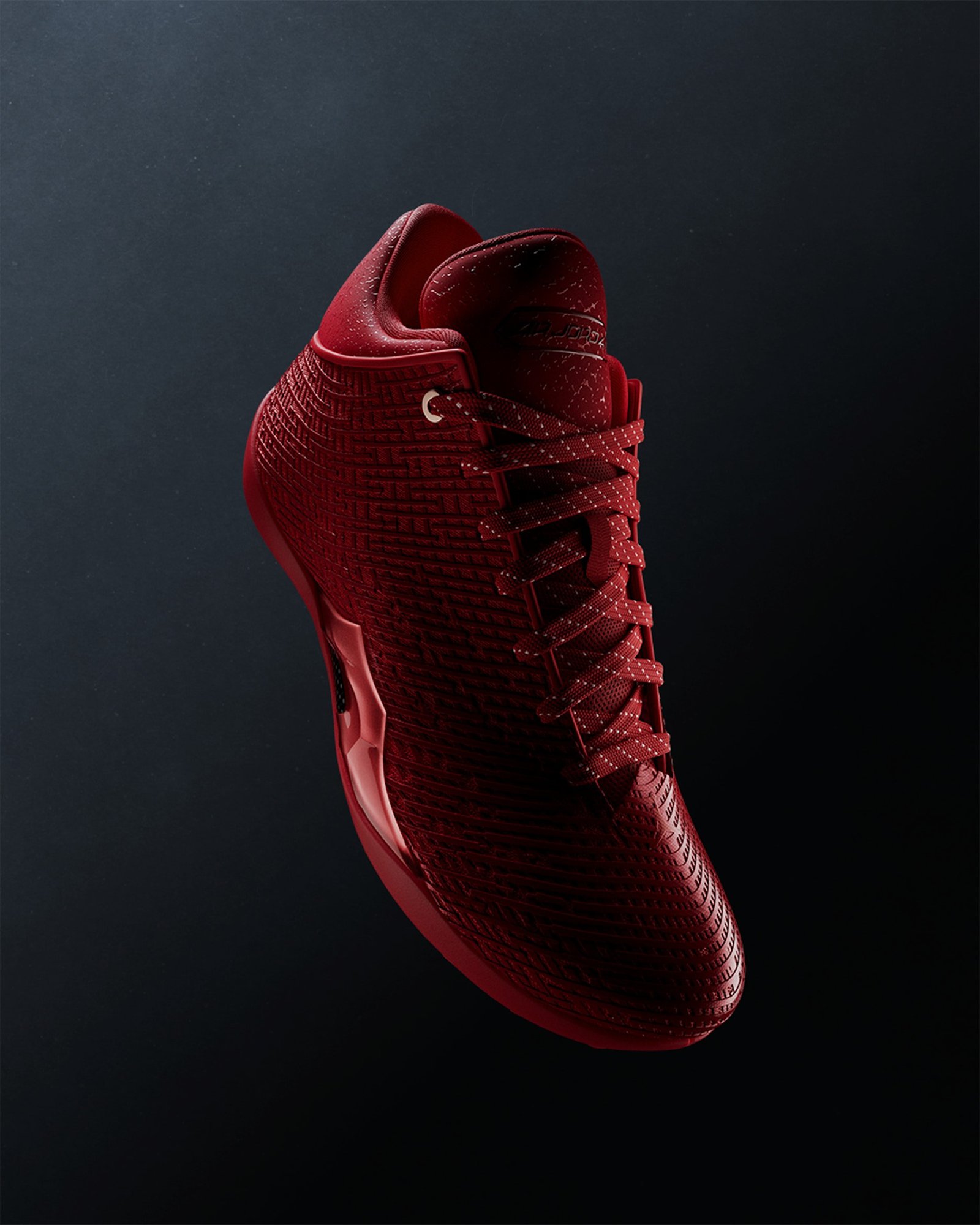 Air Jordan 41 Ruby in University Red and Infrared 23, angled view on a dark background