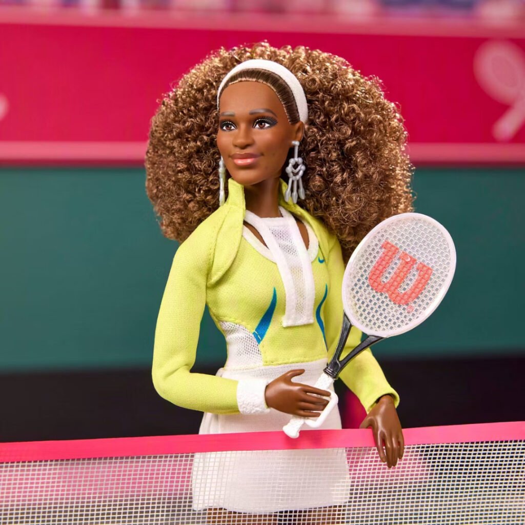 Close-up of the Barbie Signature Serena Williams doll holding a racket at the net
