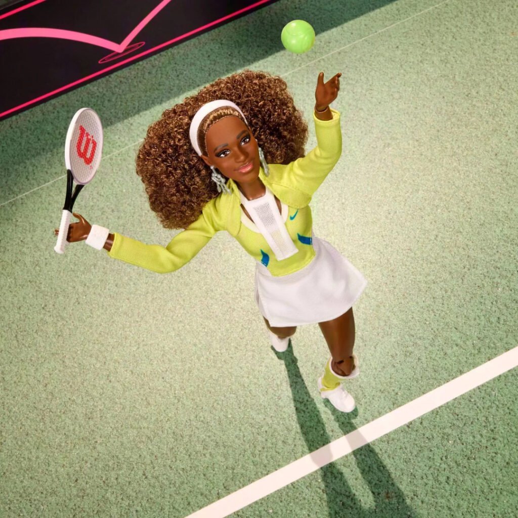 Barbie Signature Serena Williams doll tossing a tennis ball to serve