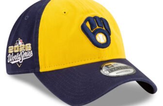Milwaukee Brewers New Era 2026 World Series Side Patch 9TWENTY hat in gold and navy, 3/4 view with side patch