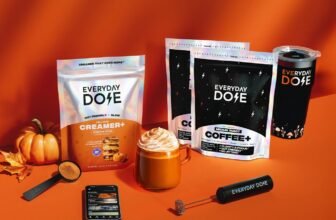 Everyday Dose Medium Roast Coffee with free starter kit and Pumpkin Spice Creamer on an orange background