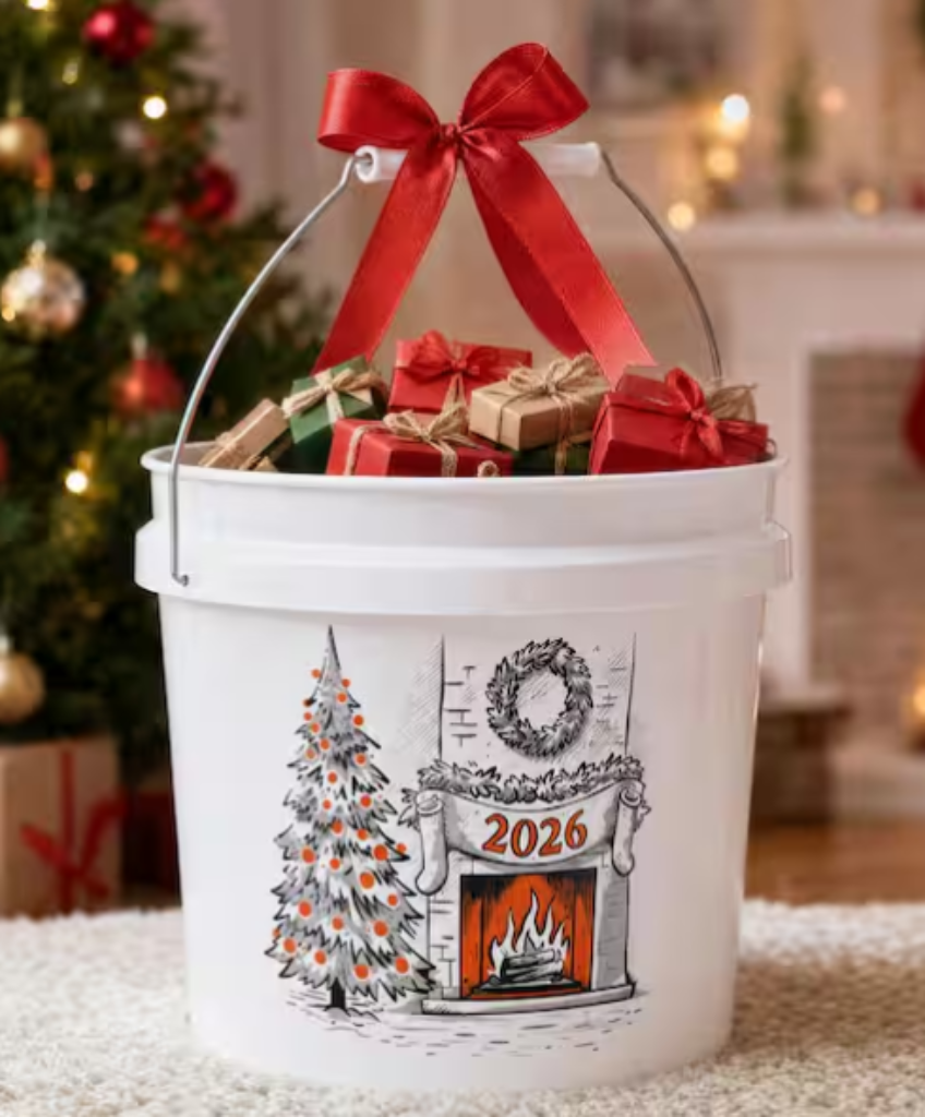Home Depot 2 Gal. White Holiday Bucket 2026 filled with wrapped gifts by the fireplace