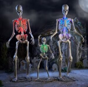 Ultra Skelly skeletons lit up in red, green and blue in a graveyard scene
