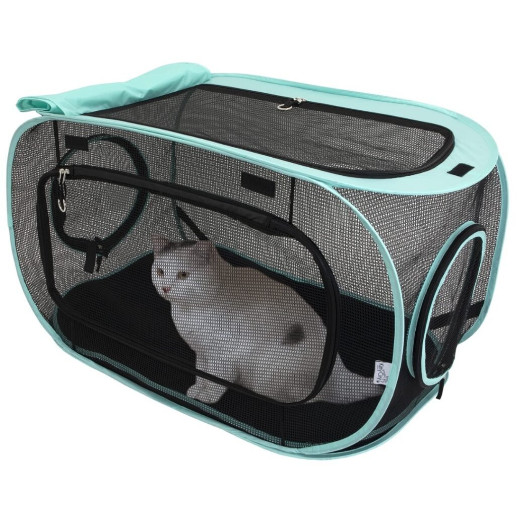Kitty City Outdoor Mega Kit pop-up mesh cat tent with a white cat inside