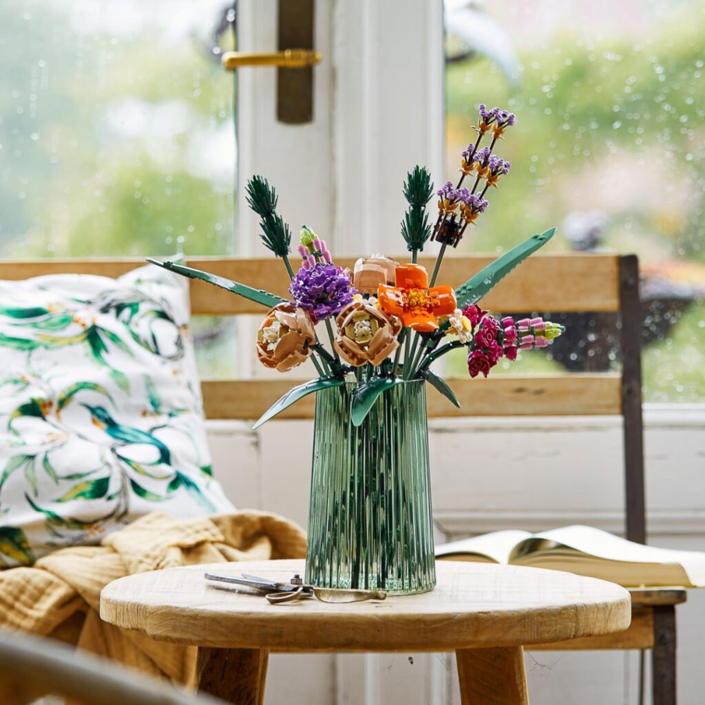 LEGO Botanicals Flower Bouquet 10280 in a glass vase by a rainy window