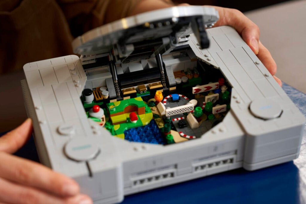 LEGO PlayStation with the lid open, showing a game diorama inside