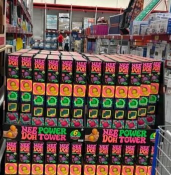 NeeDoh Power Tower 6-pack boxes on a pallet display in a Sam's Club warehouse aisle
