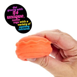 Hand squeezing a pink swirl mini NeeDoh toy from an advent calendar door