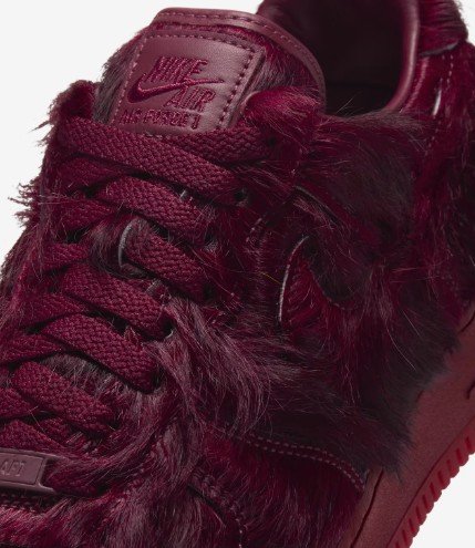 Close-up of the red laces and fuzzy upper on the Air Force 1 Team Red