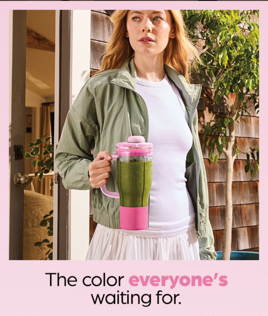 Woman holding a pink Ninja BlendBOSS tumbler