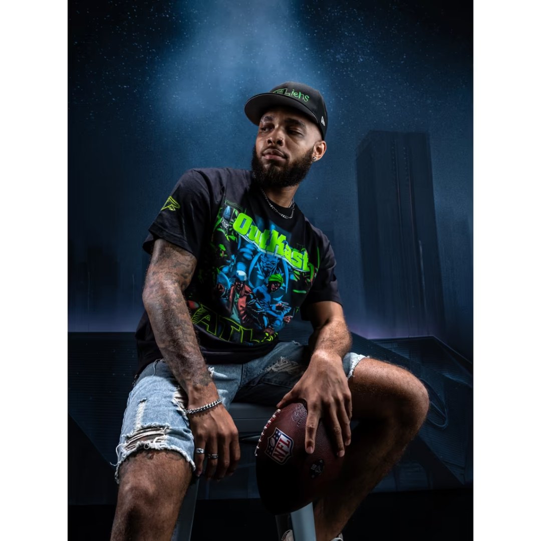 Model wearing the Outkast x Atlanta Falcons ATLiens album cover tee