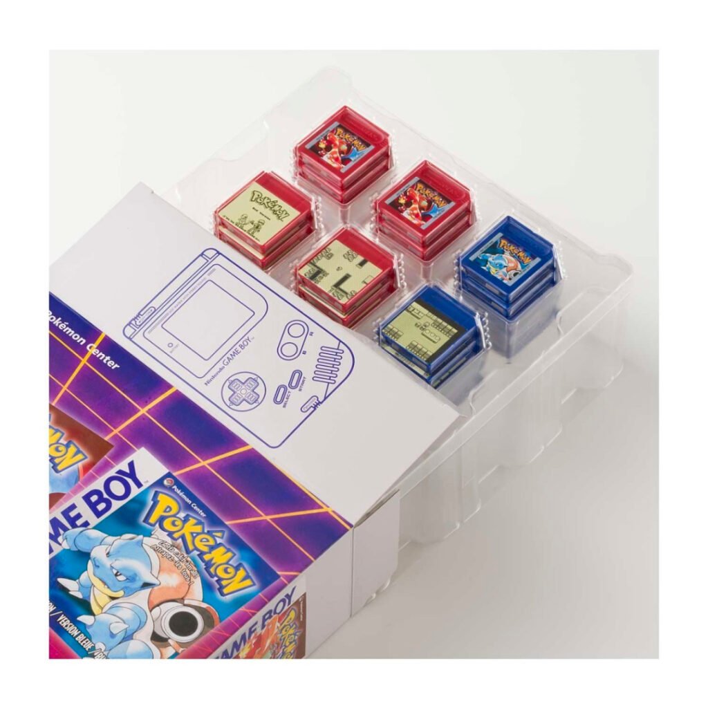 Inside the Game Boy Jukebox box: stacked red and blue mini cartridges in the tray