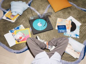 Sony PS-LX3BT turntable overhead lifestyle with vinyl records on rug