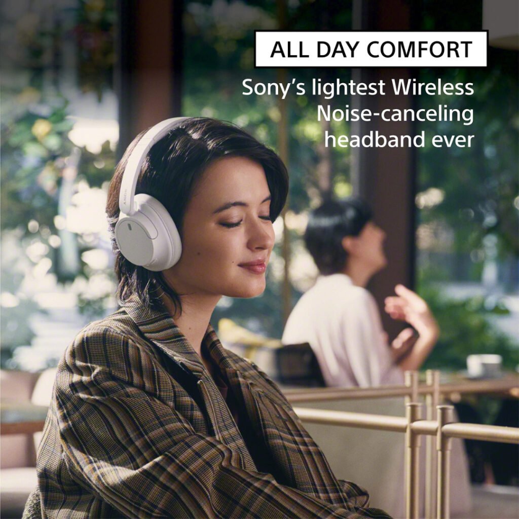 Woman wearing Sony WH-CH720N headphones working at a laptop