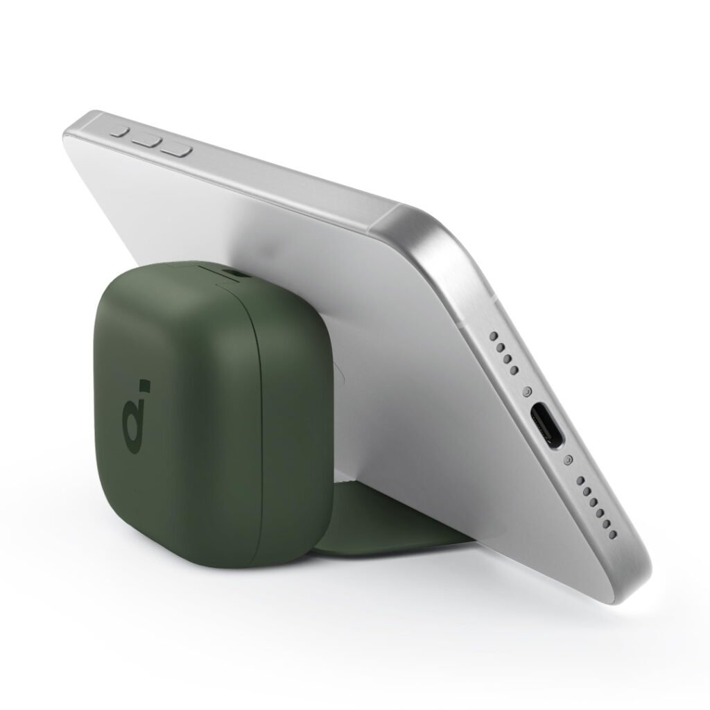 Soundcore P30i green charging case used as a phone stand